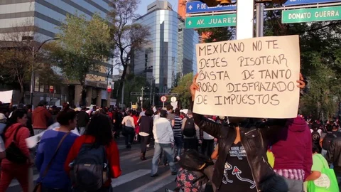Protesters march and shout slogans against a planned rise in fuel prices. Stock Footage 78233896