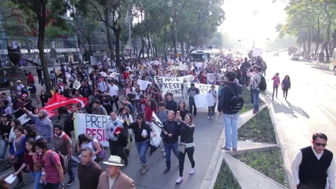 Protesters march and shout slogans against a planned rise in fuel prices. Stock Footage 78234121