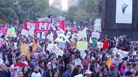 Protesters march and shout slogans against a planned rise in fuel prices. Stock Footage 78252254