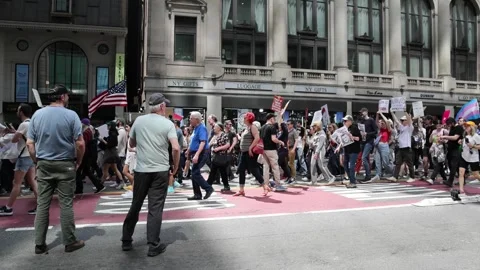 Protesters march down 42nd street midtown Manhattan protesting Donald Trump. Stock Footage 307135783