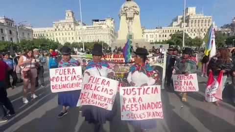 Protesters march to Peru's Congress over rising crime rates, PERÚ, PE - 15 May 2 Video stock 309171573