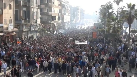 Protesters' march through Cairo streets during Egypt's revolution events Stock Footage 114848398