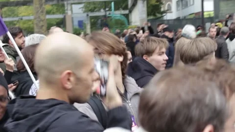 Protesters march through Paris over living costs Stock Footage 348526742