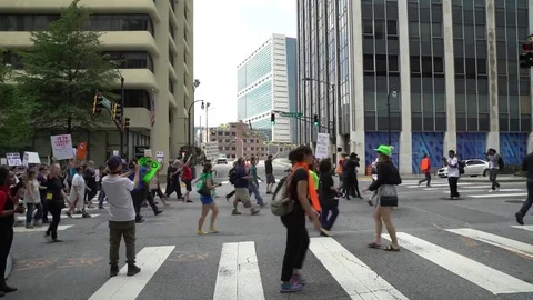 Protesters marching in Atlanta during May Day rally Stock Footage 76781695