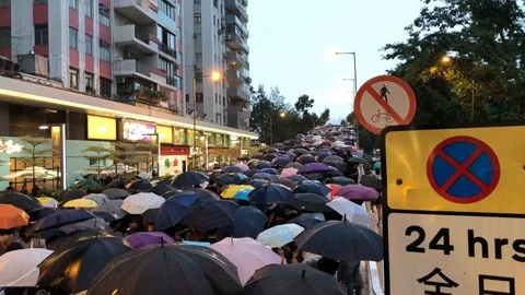 Protesters marching on Flyover to Central under heavy rain neglecting police ban Stock Footage 116322095