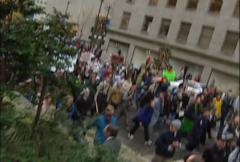Protesters Marching Through Downtown Seattle at WTO Protests 스톡 동영상 106827668