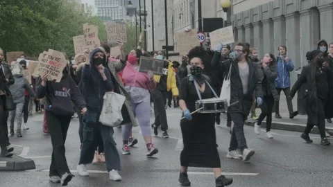 Protesters marching through London Streets for Black Lives Matter Protest Stock Footage 132107347