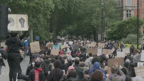 Protesters marching through London Streets for Black Lives Matter Protest Stock Footage 132107401