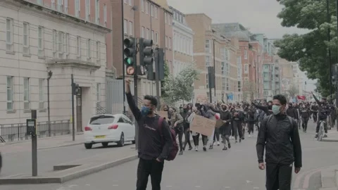 Protesters marching through London Streets for Black Lives Matter Protest Stock Footage 132108291