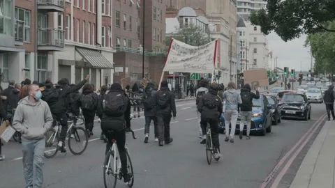 Protesters marching through London Streets for Black Lives Matter Protest London Stock Footage 132108451