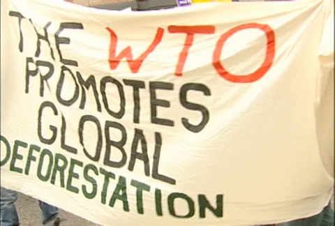 Protesters Marching Through Seattle with Signs and Banners at WTO Protests Stock Footage 106903724