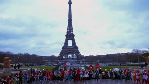 Protesters in Paris near the Eiffel Tower with large posters and flags. Stock Footage 167609872