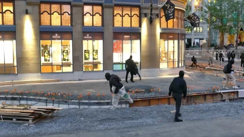 Protesters pitching rocks in window and pushing fences Stock Footage 132500556