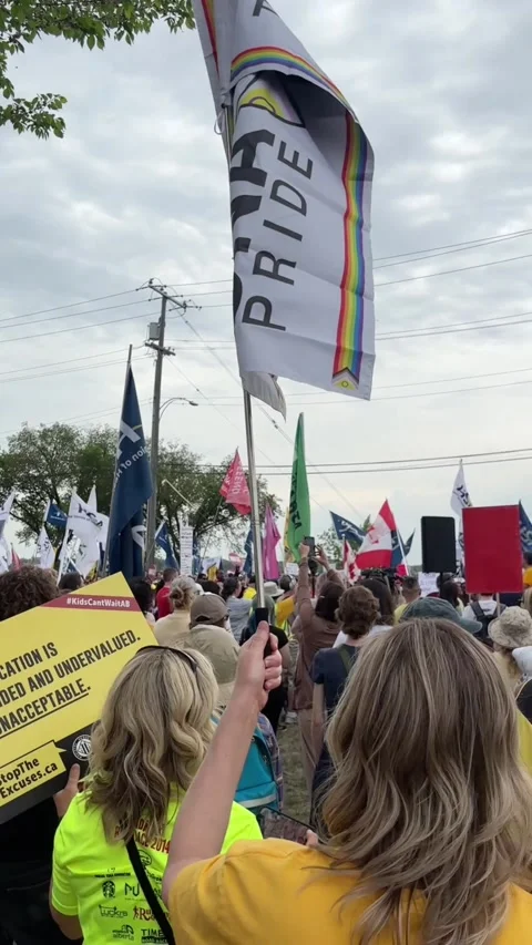 Protesters at a province-wide day of protest against the UCP 스톡 동영상 336105795