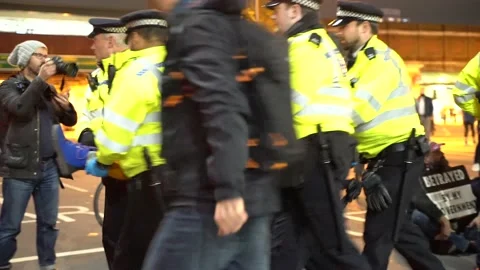 Protesters is pulled off away from blocking Vauxhall Bridge Stock Footage 165518732