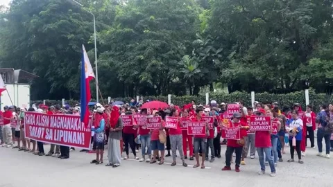 Protesters rally against Philippines VP Sara Duterte outside Senate building, Pa Stock Footage 346673152