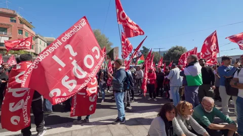 Protesters with Red Union Flags at Street Demonstration in Rome, Italy, 2025 Stock Footage 319027831