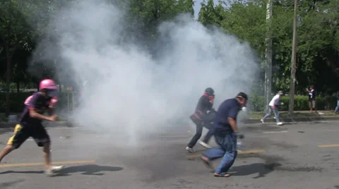 PROTESTERS RIOT POLICE TEAR GAS Stock Footage