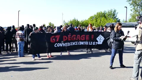 Protesters showing a huge poster before the beginning of a protest Stock Footage 95266453