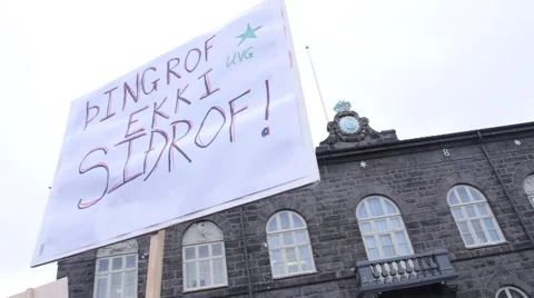 Protesters sign, pan to crowd Stock Footage 61919145