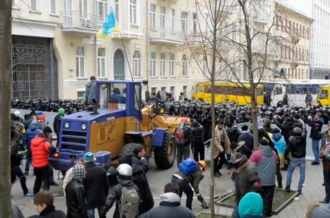 Protesters stand on bulldozer Stock Photos
