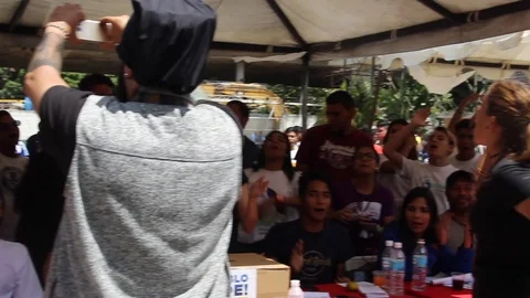 Protesters take to the streets demonstrators against Nicolas Maduro Stock Footage 100654837