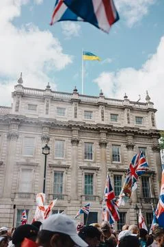 Protesters with Union Jack Flags Outside Historic London Building with Ukra.. Stock Photos