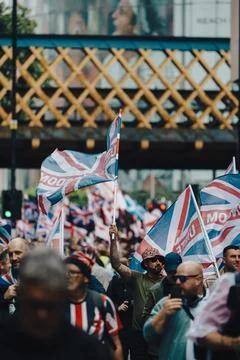 Protesters wave Union Jack flags at London free speech rally Stock Photos