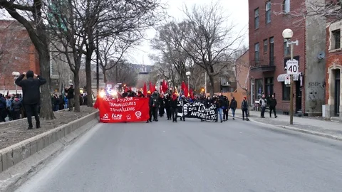 Protesters wearing red and black Stock Footage 114762508
