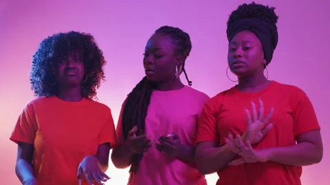 Protesting gesture female friends neon light Stock Footage 233874582