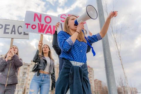 Protesting loud together on the street while shouting, low angle Stock Photos