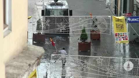 A Protestor Confronting Water Cannon During the Gezi Park Protest in Istanbul Video stock 117436035