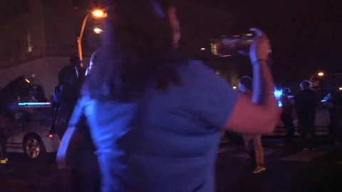 Protestor cornered and other comes to help him Stock Footage 136127553