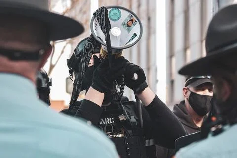 Protestor holding megaphone Stock Photos