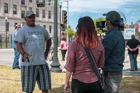 Protestor interview Stock Photos