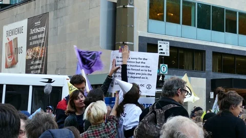 Protestor sticking poster in the street Stock Footage 120039088