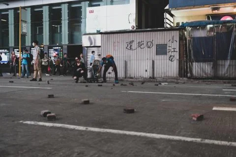 Protestor throwing brick in Mong Kok, Hong Kong Stock Photos