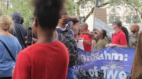 Protestors asking for the resignation of Rahm Emanuel Stock Footage 93218432