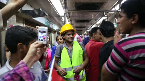 Protestors chant while aboard a metro in Cairo, Egypt. Video stock 25481350