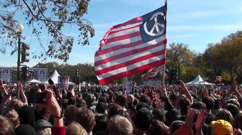 Protestors fly a huge American flag with a peace sign on it in Washington D.C. Stock Footage