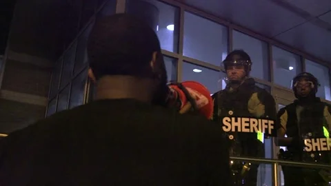 Protestors in front of jailhouse Stock Footage 136128638