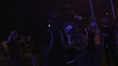 Protestors link arms Stock Footage 136128535