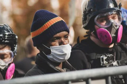 Protestors in masks Stock Photos