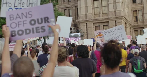 Protestors at pro choice abortion rally supporting women’s rights and Stock Footage 256621955