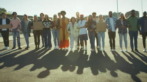 Protestors stand united on highway Stock Footage 327083194