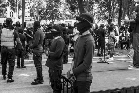 Protestors standing in a row Stock Photos