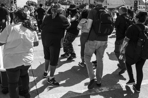 Protestors walking through the streets Stock Photos