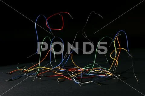 Protoboard jumper wires on black background Stock Photos