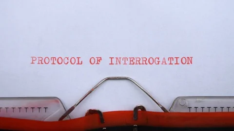 Protocol of interrogation - phrase printed on an old typewriter in red letters Video stock 128400503