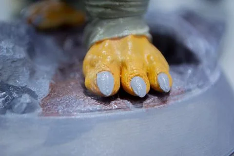Prototype art object 3D printed melted blue plastic Model paw created 3D printer Stock Photos